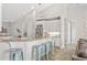 Open-concept kitchen featuring granite countertops, stainless steel appliances, and ample seating at 40137 County Road 452, Leesburg, FL 34788