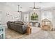 A well-decorated living room with tile floors, white shiplap accents, and stylish furnishings at 40137 County Road 452, Leesburg, FL 34788
