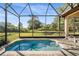 Cool off in the inviting pool surrounded by brick paving, within the comfort of a screened enclosure and private backyard at 40137 County Road 452, Leesburg, FL 34788