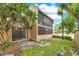 The backyard features a grassy area, perfect for relaxation and entertainment, with a screened porch on the building at 419 Sheoah Blvd # 27, Winter Springs, FL 32708