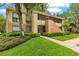 Well-maintained building with lush landscaping and a manicured lawn, creating an inviting curb appeal at 419 Sheoah Blvd # 27, Winter Springs, FL 32708