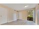 Bright living room featuring neutral paint, wood-look flooring, and a large window at 419 Sheoah Blvd # 27, Winter Springs, FL 32708