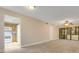 Open floor plan with view of kitchen featuring white appliances and tile floors at 419 Sheoah Blvd # 27, Winter Springs, FL 32708
