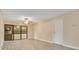 Bright living room featuring neutral paint, wood-look flooring, and a door to the patio at 419 Sheoah Blvd # 27, Winter Springs, FL 32708