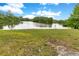 A beautiful pond reflecting the sky and surrounded by lush greenery, providing a serene natural view at 419 Sheoah Blvd # 27, Winter Springs, FL 32708