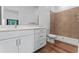 Modern bathroom featuring a sleek vanity, tile shower, and neutral color palette at 42 W Harding St # E, Orlando, FL 32806