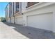 Exterior view of garages in a row, with brick paver driveway at 42 W Harding St # E, Orlando, FL 32806