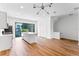 Modern kitchen with stainless appliances, a large island, and sliding glass doors to balcony, offering natural light at 42 W Harding St # E, Orlando, FL 32806