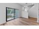 Bright living room with neutral decor, large windows, and stylish modern flooring at 42 W Harding St # E, Orlando, FL 32806
