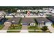 Aerial view of the neighborhood and home, near a pond with a pin marking the property at 426 Citrus Isle Loop, Davenport, FL 33837