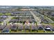 Aerial view of the neighborhood and home, in a well populated community with a pin at 426 Citrus Isle Loop, Davenport, FL 33837