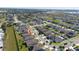 Aerial view of the neighborhood and home, in a well populated community with a pin at 426 Citrus Isle Loop, Davenport, FL 33837