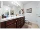 Bathroom with double sink vanity and large mirror at 426 Citrus Isle Loop, Davenport, FL 33837
