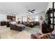 Open concept living room boasts tile floors, ceiling fan, and lots of natural light at 426 Citrus Isle Loop, Davenport, FL 33837