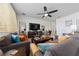 Spacious living room features tile floors, comfortable seating, and a large entertainment center at 426 Citrus Isle Loop, Davenport, FL 33837