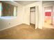 A bedroom with white walls, plush carpet and a spacious closet at 4640 Chateau Rd, Orlando, FL 32808