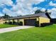 Beautiful single story home with an attached two car garage and a well manicured lawn at 4640 Chateau Rd, Orlando, FL 32808