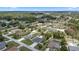 Aerial view of a single-Gathering home, in-ground pool, fenced yard, and surrounding neighborhood at 4811 Sw 108Th Place Rd, Ocala, FL 34476