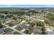 Aerial view of the property showcasing a single-Gathering home, in-ground pool, fenced yard, and surrounding neighborhood at 4811 Sw 108Th Place Rd, Ocala, FL 34476