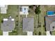 Aerial view of the home, large manicured lot, vinyl fence, and pool area at 4811 Sw 108Th Place Rd, Ocala, FL 34476