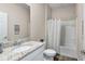 Bright bathroom features a shower-tub combination, granite countertop, and neutral color palette at 4811 Sw 108Th Place Rd, Ocala, FL 34476