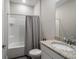 Bathroom featuring vanity with granite countertop, toilet and shower with white tile at 4811 Sw 108Th Place Rd, Ocala, FL 34476