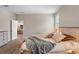 Light filled bedroom features decorative pillows, a side table, and view to the kitchen at 4811 Sw 108Th Place Rd, Ocala, FL 34476