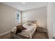 This bedroom features natural light, a wooden bed frame and neutral paint at 4811 Sw 108Th Place Rd, Ocala, FL 34476