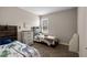 Bedroom boasts modern decor, neutral paint and a window with natural light at 4811 Sw 108Th Place Rd, Ocala, FL 34476