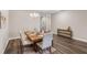 Charming dining area featuring wood-look floors and a stylish wood table at 4811 Sw 108Th Place Rd, Ocala, FL 34476
