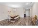 Elegant dining area with wood table, bench, and stylish chandelier at 4811 Sw 108Th Place Rd, Ocala, FL 34476