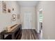 Inviting entryway featuring wood-look flooring and decorative accents at 4811 Sw 108Th Place Rd, Ocala, FL 34476