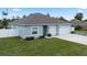 Well-maintained single-story home featuring a spacious garage, and manicured lawn at 4811 Sw 108Th Place Rd, Ocala, FL 34476