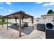 Outdoor gazebo with a full dining set and BBQ, perfect for outdoor entertaining by the pool at 4811 Sw 108Th Place Rd, Ocala, FL 34476
