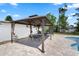 Poolside gazebo featuring outdoor dining and cooking area, ideal for summer gatherings at 4811 Sw 108Th Place Rd, Ocala, FL 34476