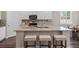 Open kitchen with stainless appliances, an island, and room for dining at 4811 Sw 108Th Place Rd, Ocala, FL 34476