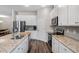 Updated kitchen featuring stainless appliances, granite countertops and modern cabinets at 4811 Sw 108Th Place Rd, Ocala, FL 34476