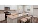 Spacious kitchen featuring granite countertops, stainless appliances, and island seating at 4811 Sw 108Th Place Rd, Ocala, FL 34476
