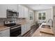 Updated kitchen with stainless appliances, granite countertops and breakfast nook with window at 4811 Sw 108Th Place Rd, Ocala, FL 34476