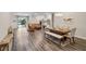 Spacious open-concept living and dining area with wood-look floors and modern decor at 4811 Sw 108Th Place Rd, Ocala, FL 34476