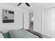 Cozy bedroom featuring a metal bed frame, walk-in closet, and neutral color palette at 5033 Starling Bird Ln, St Cloud, FL 34771