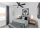Inviting bedroom featuring a neon headphone art piece and modern furnishings at 5033 Starling Bird Ln, St Cloud, FL 34771