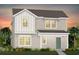 Charming two-story home with a welcoming porch and well-manicured landscaping at 5033 Starling Bird Ln, St Cloud, FL 34771