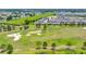 Aerial view showcasing the surrounding community golf course and manicured landscaping at 5215 Nw 34Th St, Ocala, FL 34482