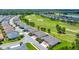 Aerial view of the community with lush landscaping, homes, and a nearby golf course at 5215 Nw 34Th St, Ocala, FL 34482