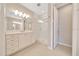 Bathroom featuring double vanity, walk-in glass shower, and modern lighting at 5215 Nw 34Th St, Ocala, FL 34482