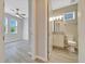 Modern bathroom with granite countertops, white vanity and wood-look tile flooring at 5215 Nw 34Th St, Ocala, FL 34482