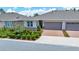 Charming home featuring a two-car garage and beautifully landscaped front yard at 5215 Nw 34Th St, Ocala, FL 34482