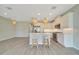 Modern kitchen with white cabinetry, stainless steel appliances, and an island with seating at 5215 Nw 34Th St, Ocala, FL 34482