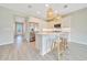 Bright, modern kitchen with white cabinetry, stainless steel appliances, and island seating at 5215 Nw 34Th St, Ocala, FL 34482